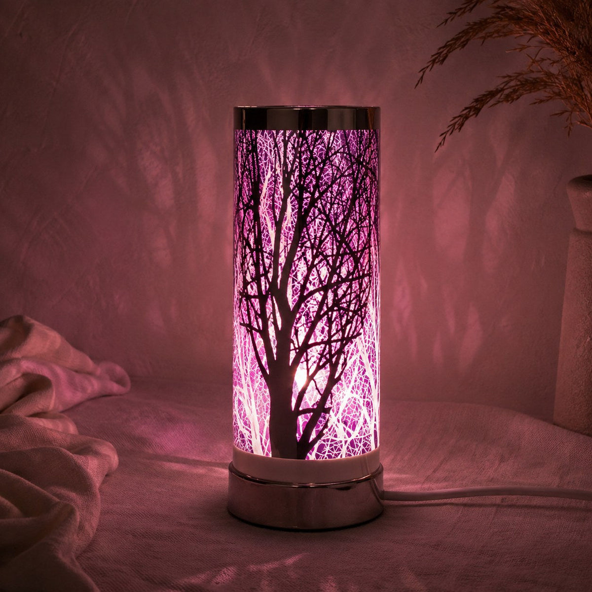 Purple and silver aroma lamp lit at night