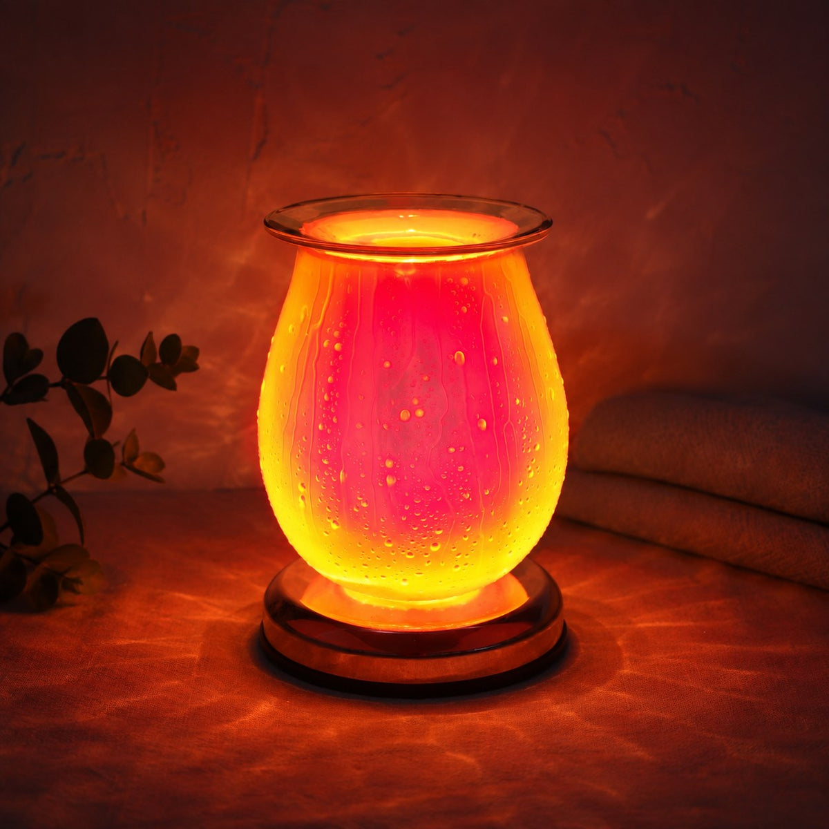 Waterdrop pink burner lit at night