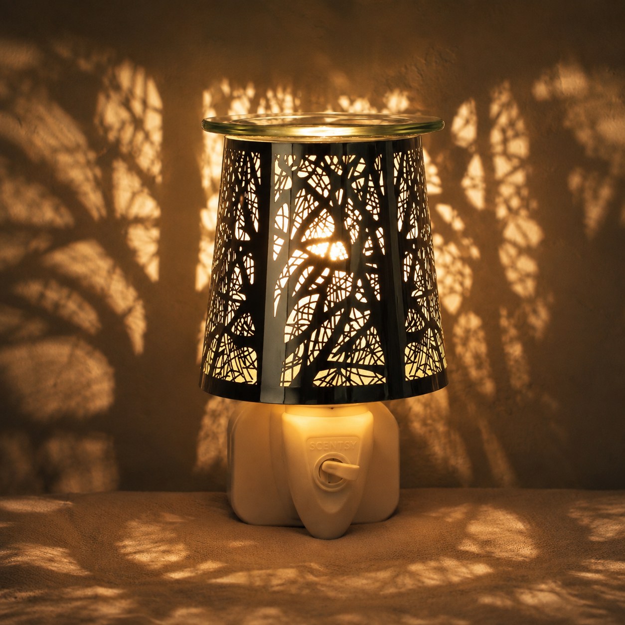 Forrest plug in wax melter lit at night