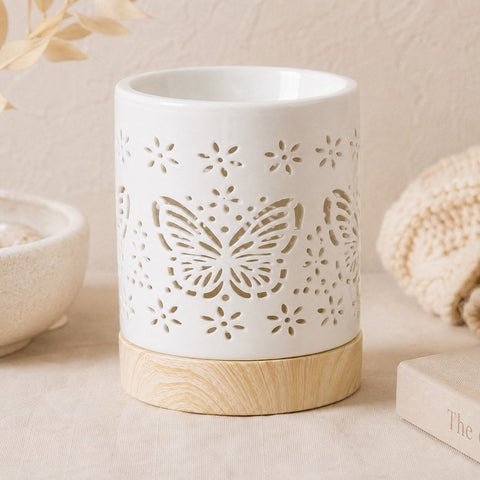 Butterfly ceramic wax burner on wooden base