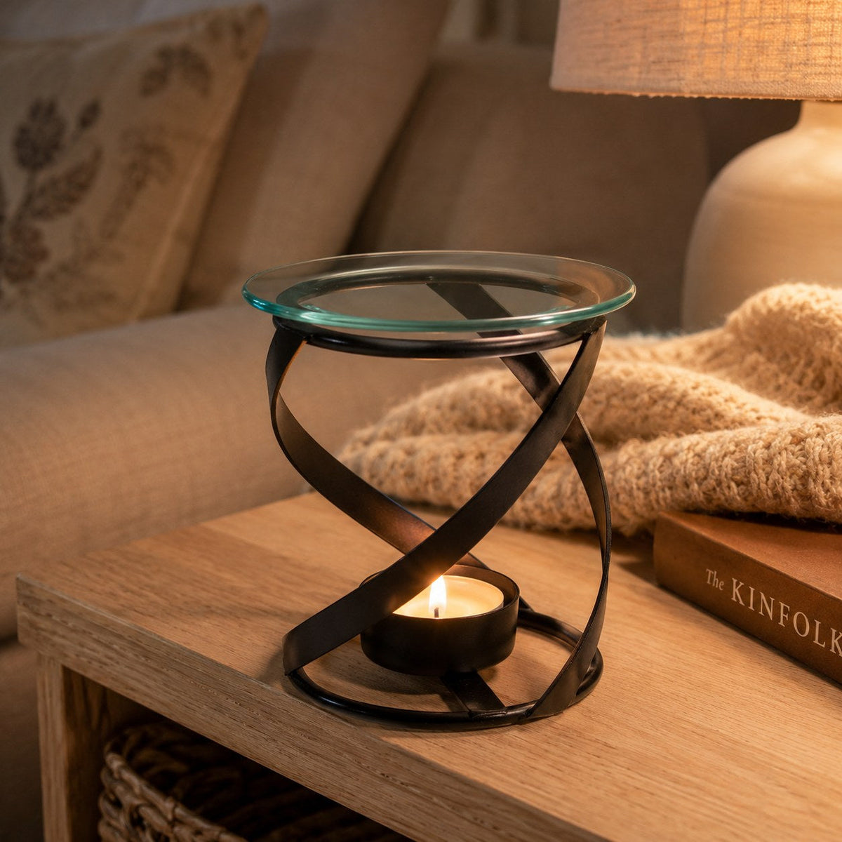Black metal spiral burner in a cosy living room