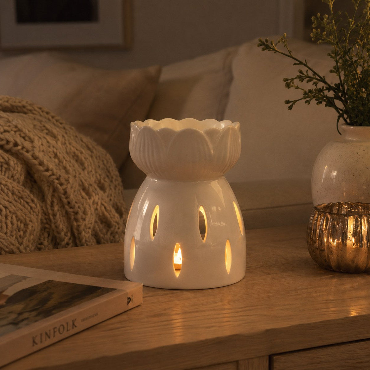 Ceramic lotus flower melter in a cosy living room